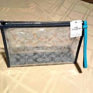 COACH CLUTCH IN SIGNATURE CLEAR CANVAS